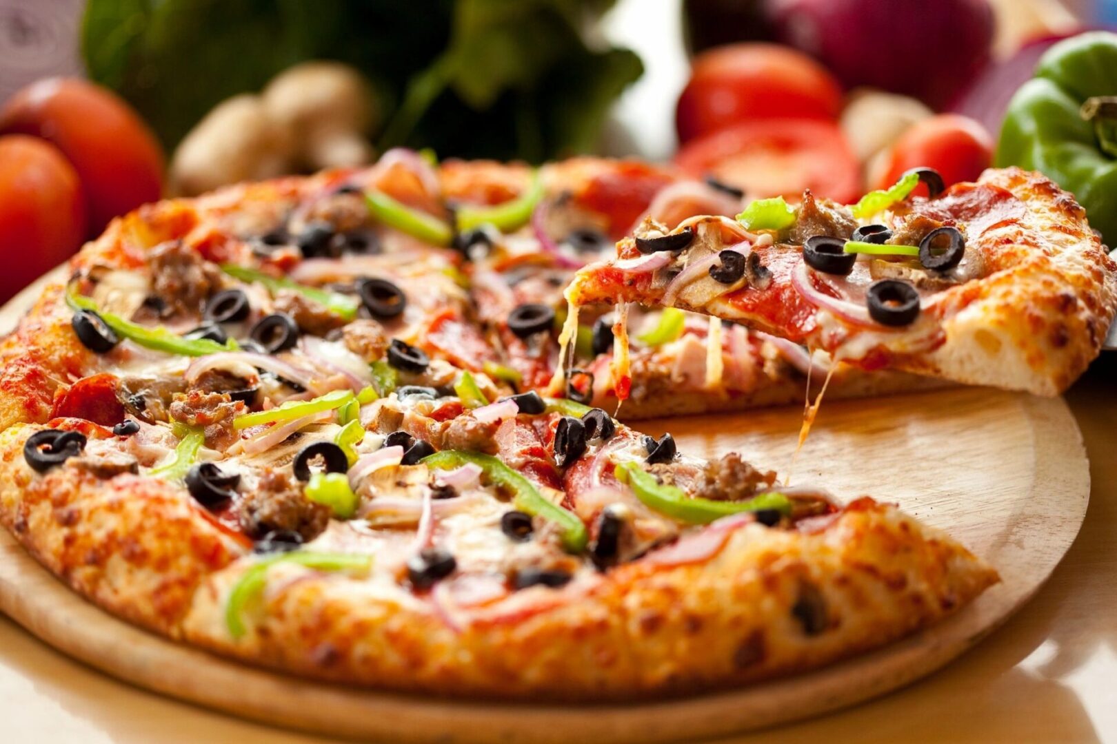 A pizza sitting on top of a wooden board.